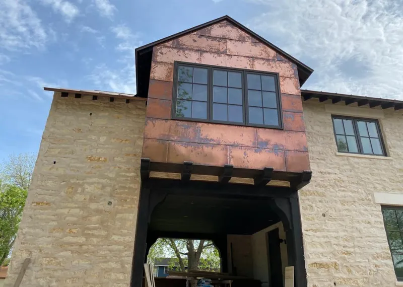 Copper metal panel facade on a stone building for Skylight Installation in Fruitridge Pocket